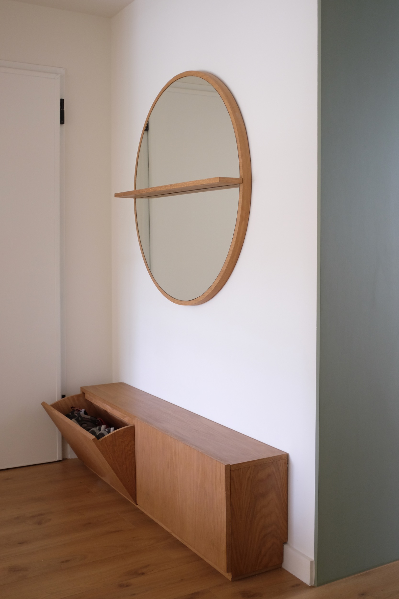 Photo of Lola Cwikowski Interior Design Studio's Carnide Apartment project, showing custom shoe cabinet, designed by Ian Leighton. Photograph © Ian Leighton